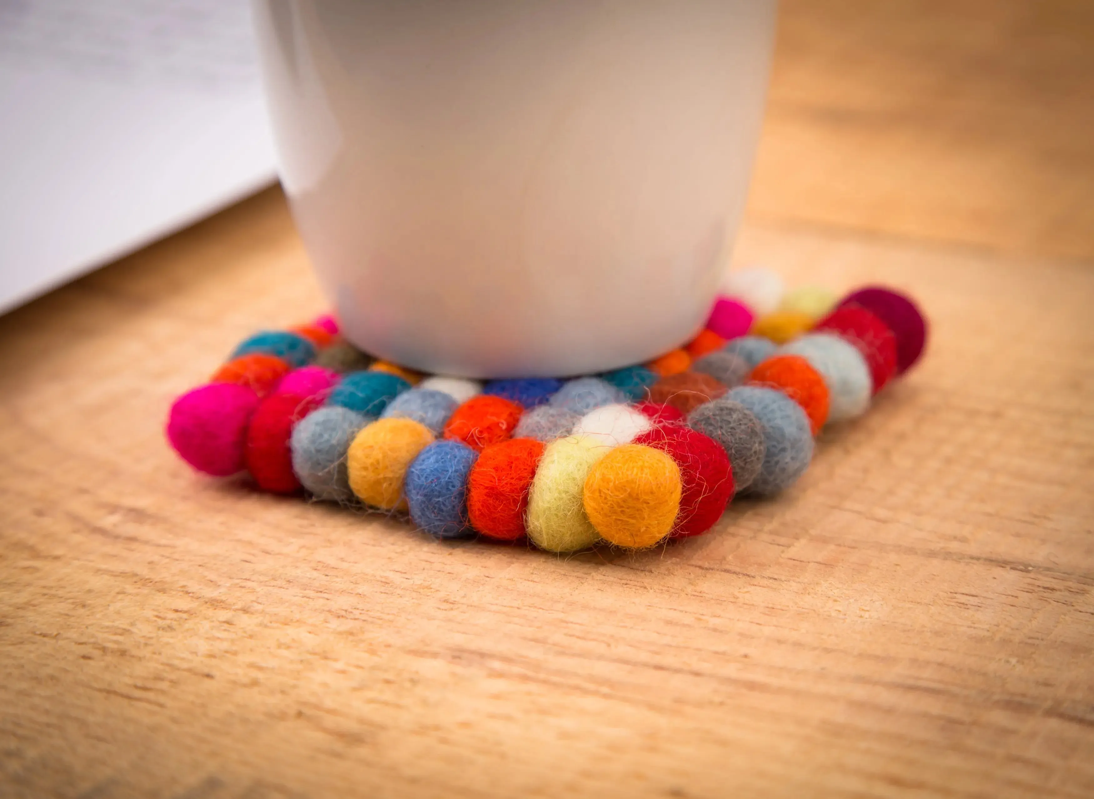 Elevate Your Table Decor with Handcrafted Wool Felt Ball Mats from Nepal – The Perfect Tea Coasters